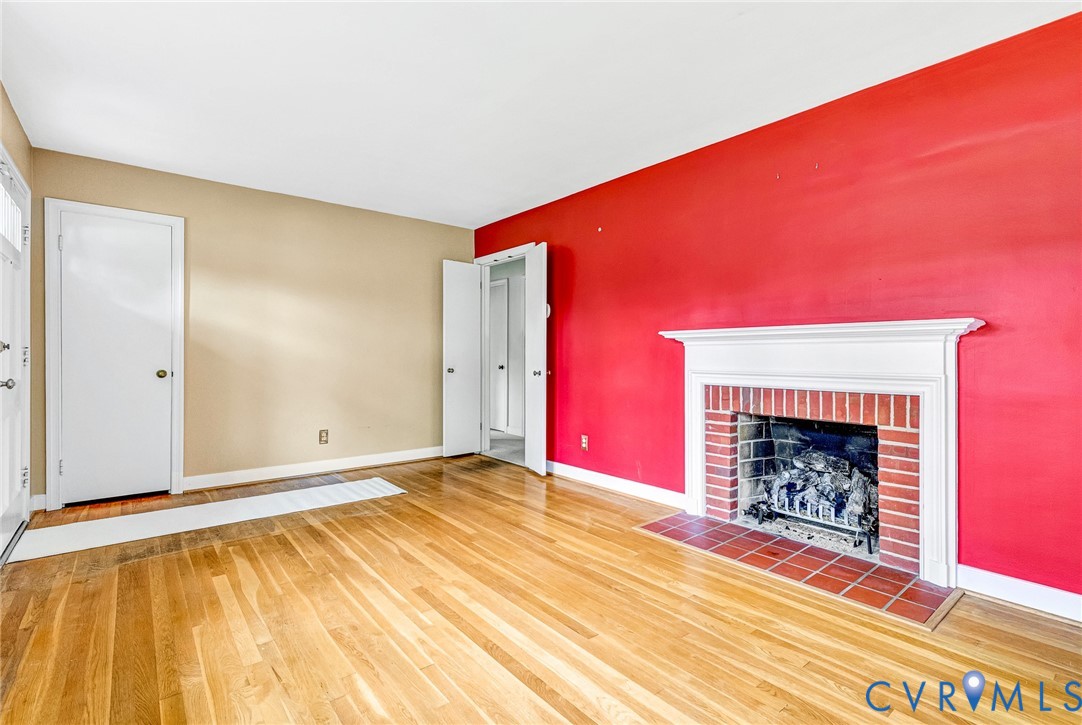 8728 Holly Hill Road Henrico, VA 23229 - Photo 7 of 36 Unfurnished living room featuring wood finished fl