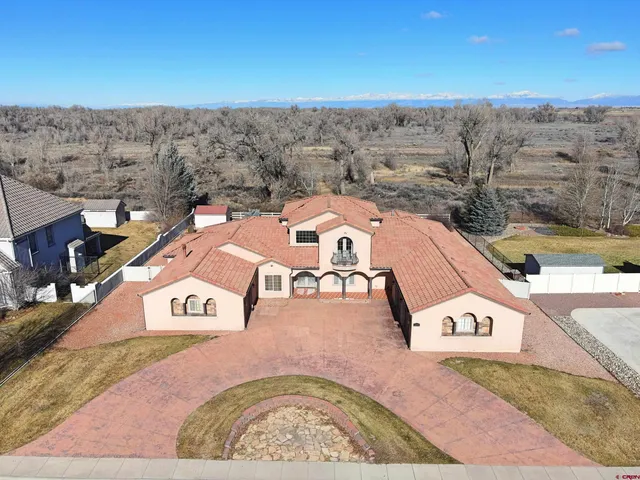 a bed sitting in a bedroom next to a lamp