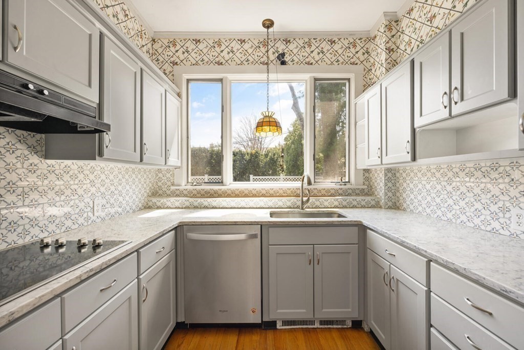 11 Stratford Road Winchester, MA 01890 - Photo 11 of 31 a kitchen with sink cabinets and window