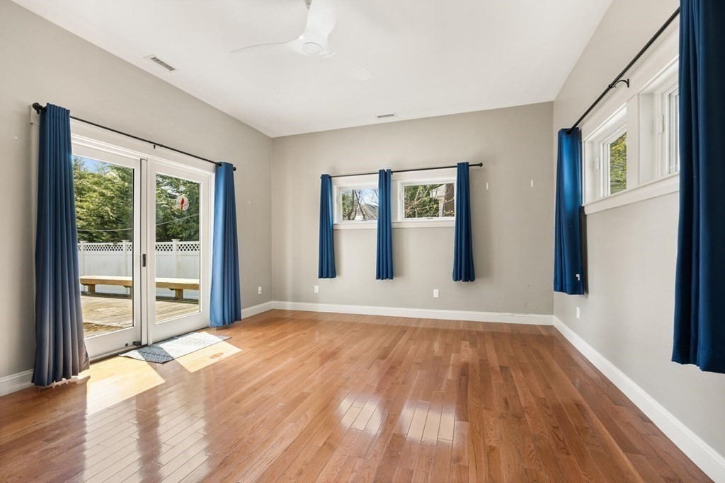 11 Stratford Road Winchester, MA 01890 - Photo 12 of 31 a view of an empty room with window and wooden floor