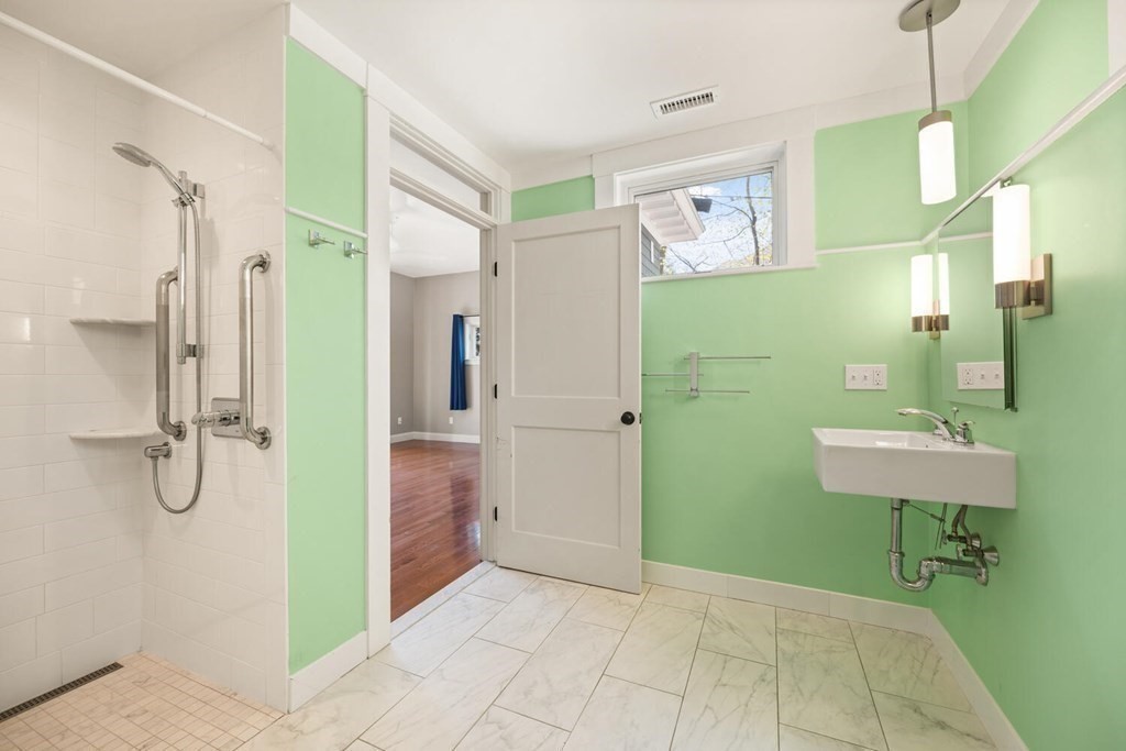 11 Stratford Road Winchester, MA 01890 - Photo 15 of 31 a bathroom with a sink a toilet and shower