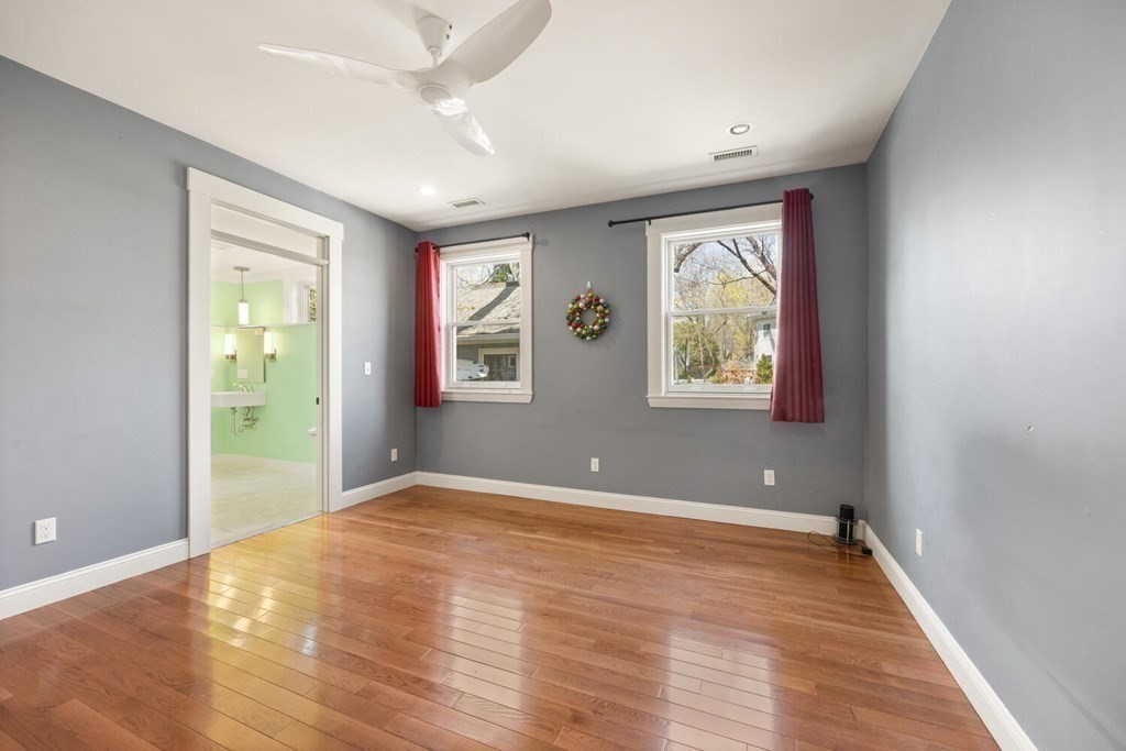 11 Stratford Road Winchester, MA 01890 - Photo 16 of 31 a view of an empty room with wooden floor and a window