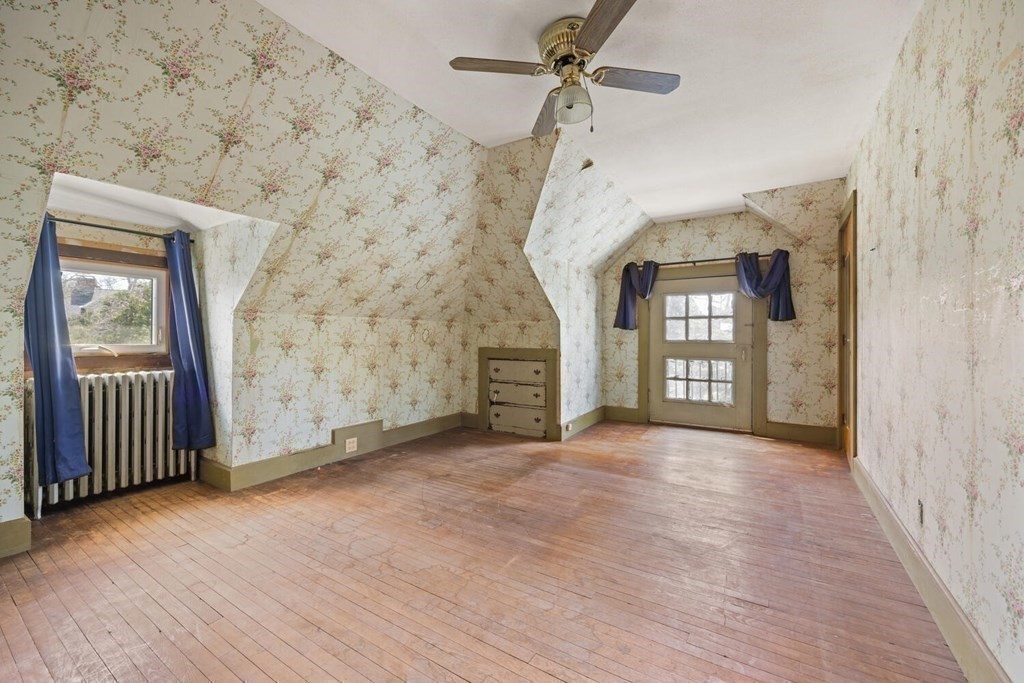 11 Stratford Road Winchester, MA 01890 - Photo 18 of 31 a view of an empty room with window and wooden floor