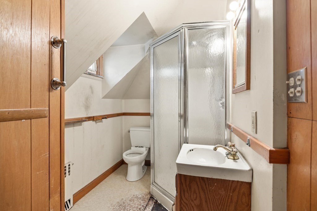 11 Stratford Road Winchester, MA 01890 - Photo 19 of 31 a bathroom with a sink toilet and shower