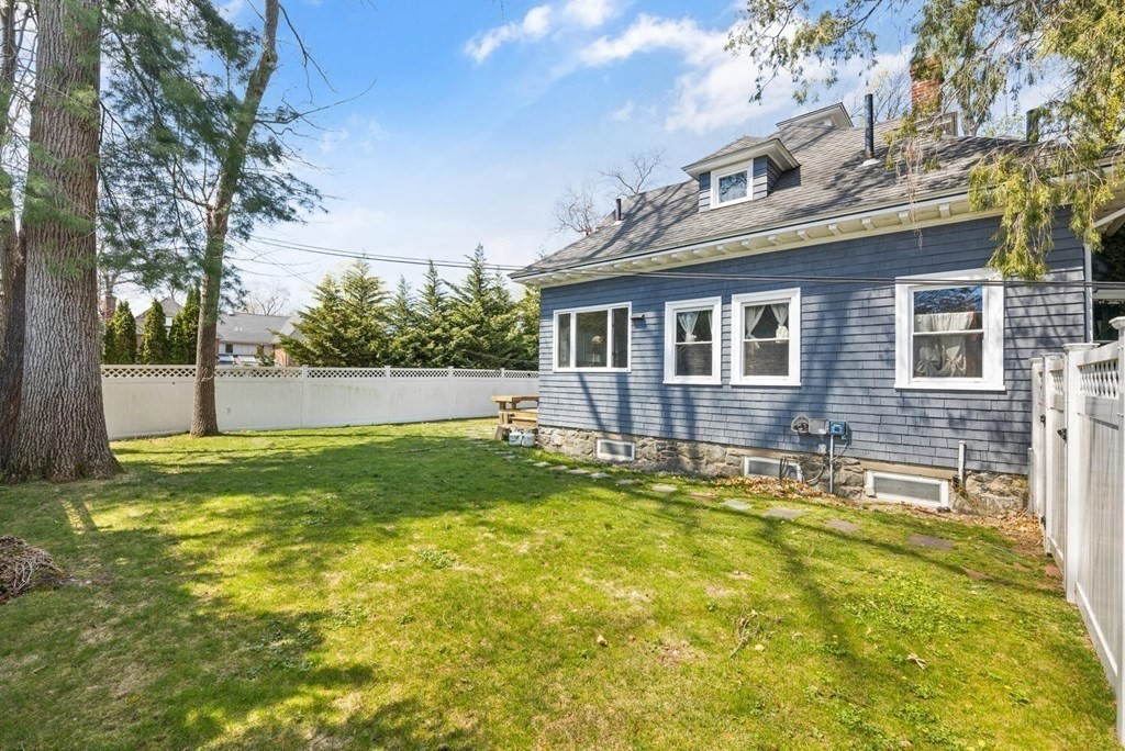 11 Stratford Road Winchester, MA 01890 - Photo 27 of 31 a backyard of a house with a garden and barbeque oven
