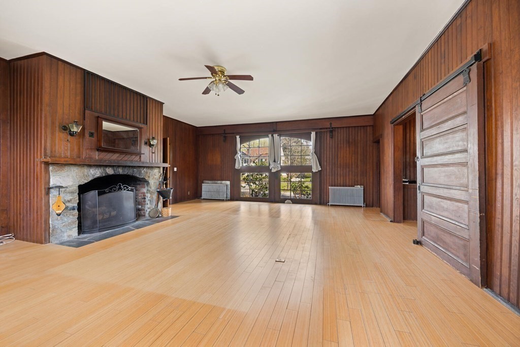 11 Stratford Road Winchester, MA 01890 - Photo 3 of 31 a view of empty room with furniture and a fireplace