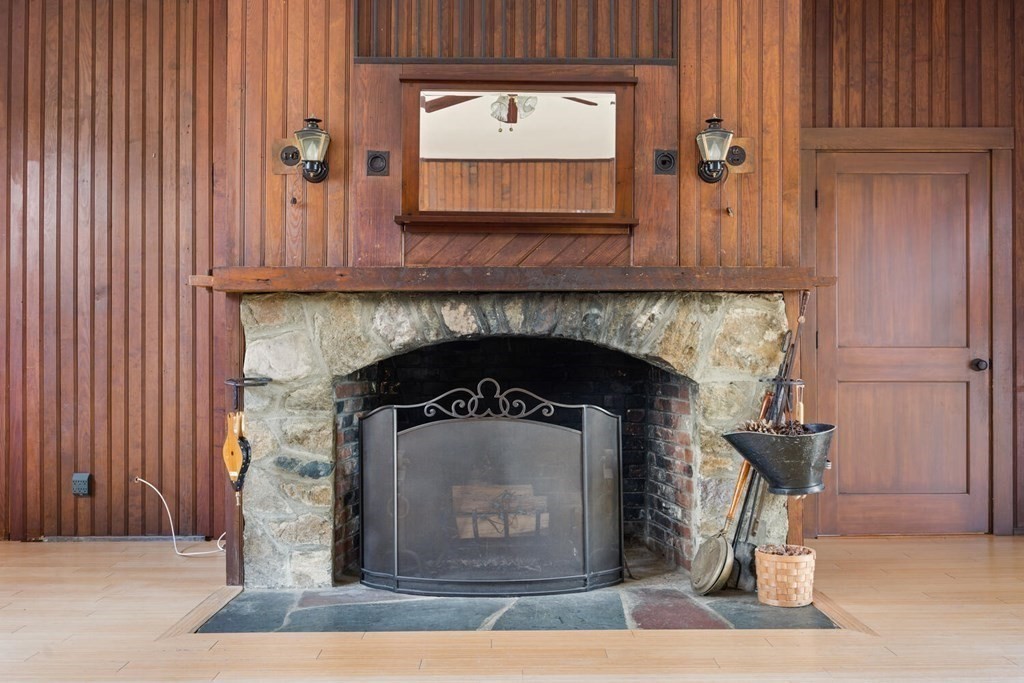 11 Stratford Road Winchester, MA 01890 - Photo 5 of 31 a closeup of a fireplace with a wooden door