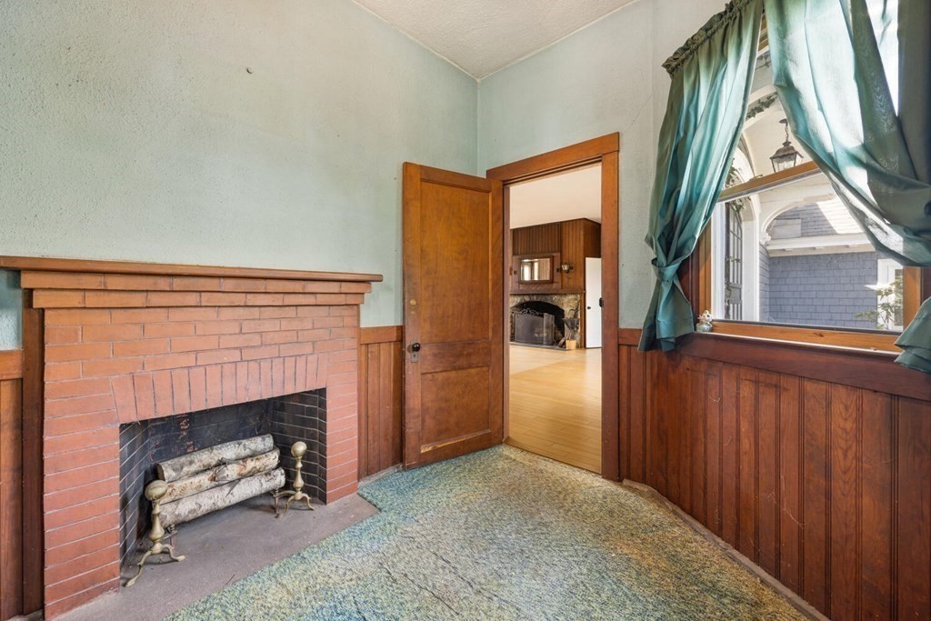 11 Stratford Road Winchester, MA 01890 - Photo 7 of 31 a view of a livingroom with a fireplace and a window