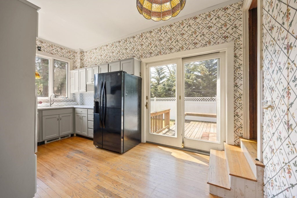 11 Stratford Road Winchester, MA 01890 - Photo 9 of 31 a kitchen with stainless steel appliances a refrigerator and a sink
