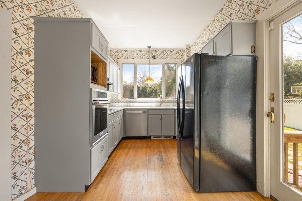 11 Stratford Road Winchester, MA 01890 - Photo 10 of 31 a kitchen with stainless steel appliances a refrigerator and a sink