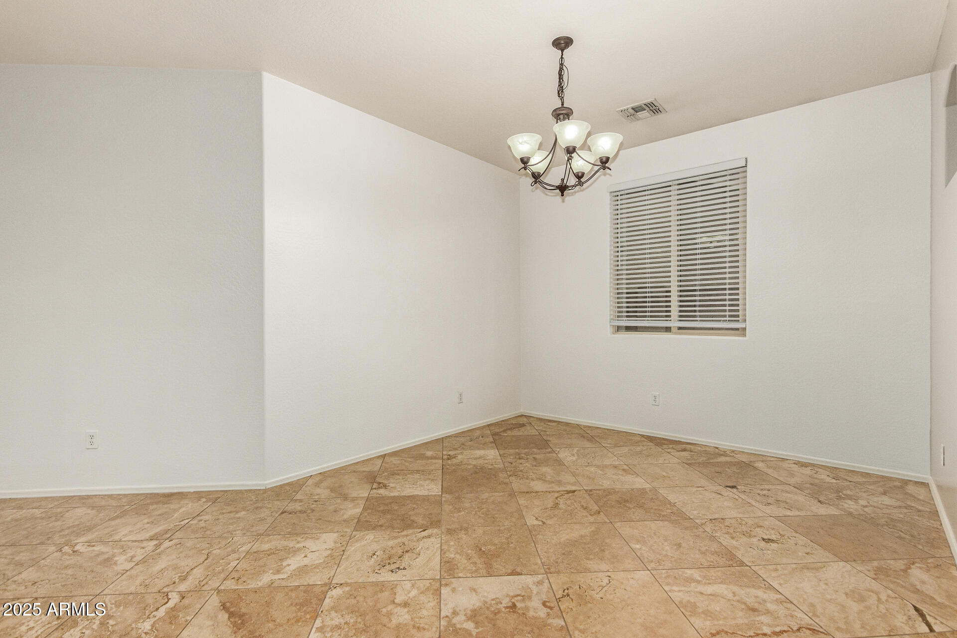9228 West Black Hill Road Peoria, AZ 85383 - Photo 10 of 44 a view of a room with a ceiling fan and a window