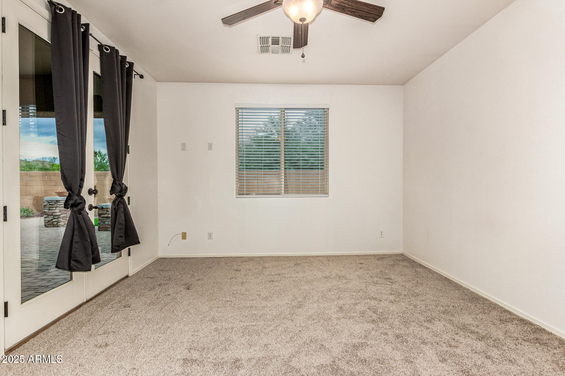 9228 West Black Hill Road Peoria, AZ 85383 - Photo 19 of 44 an empty room with windows