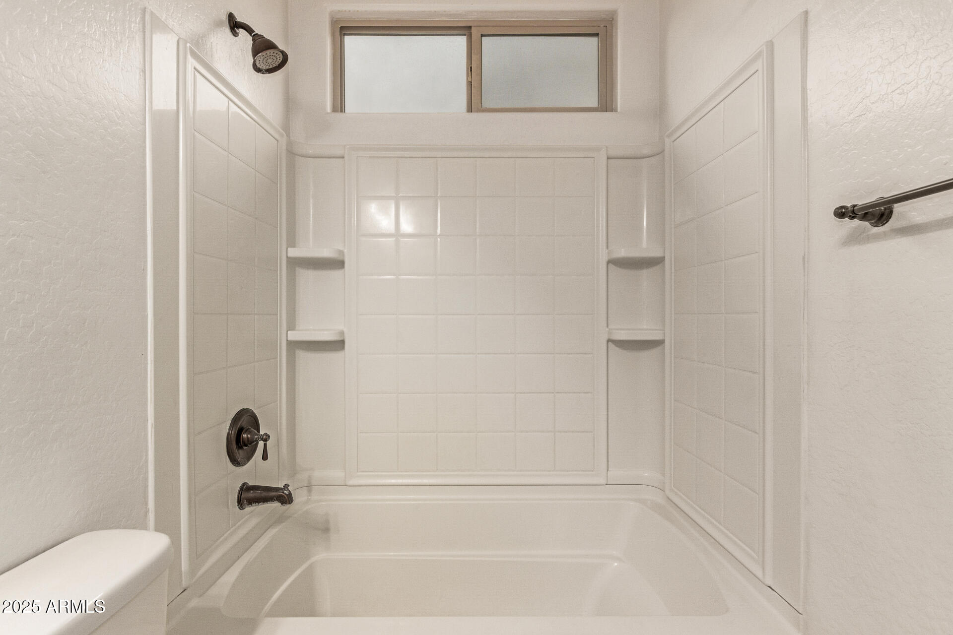 9228 West Black Hill Road Peoria, AZ 85383 - Photo 33 of 44 a bathroom with a bathtub and a shower