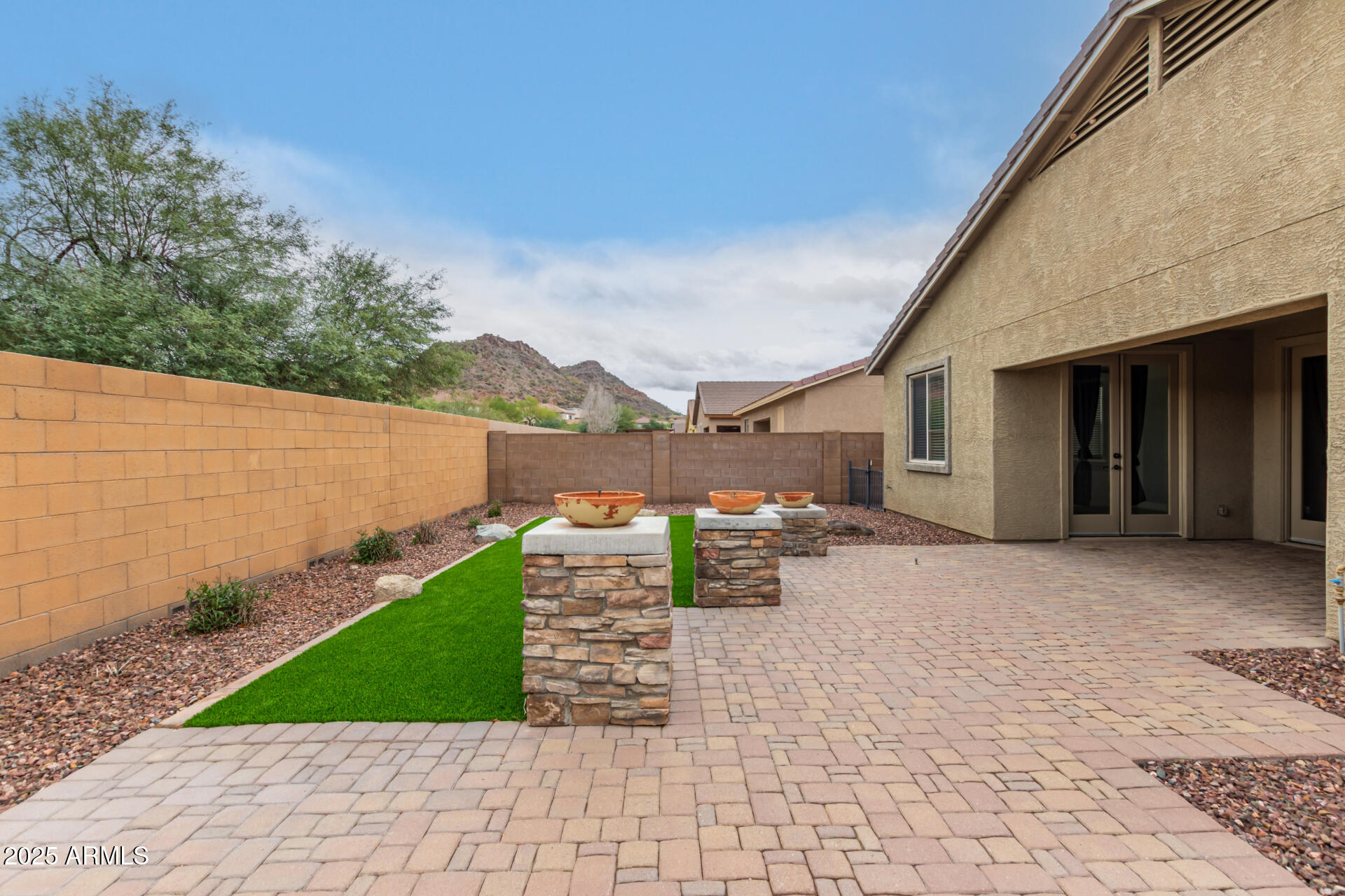 9228 West Black Hill Road Peoria, AZ 85383 - Photo 39 of 44 a view of house with backyard and outdoor space