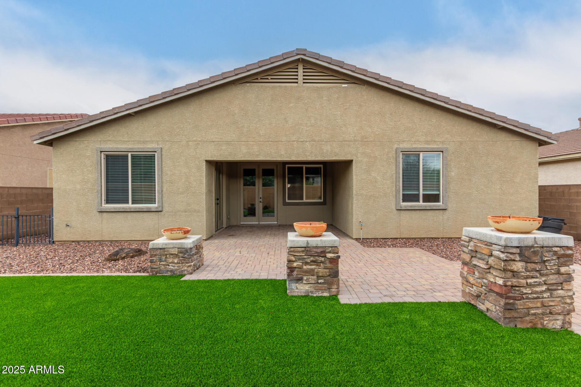 9228 West Black Hill Road Peoria, AZ 85383 - Photo 41 of 44 a front view of house with yard and outdoor seating