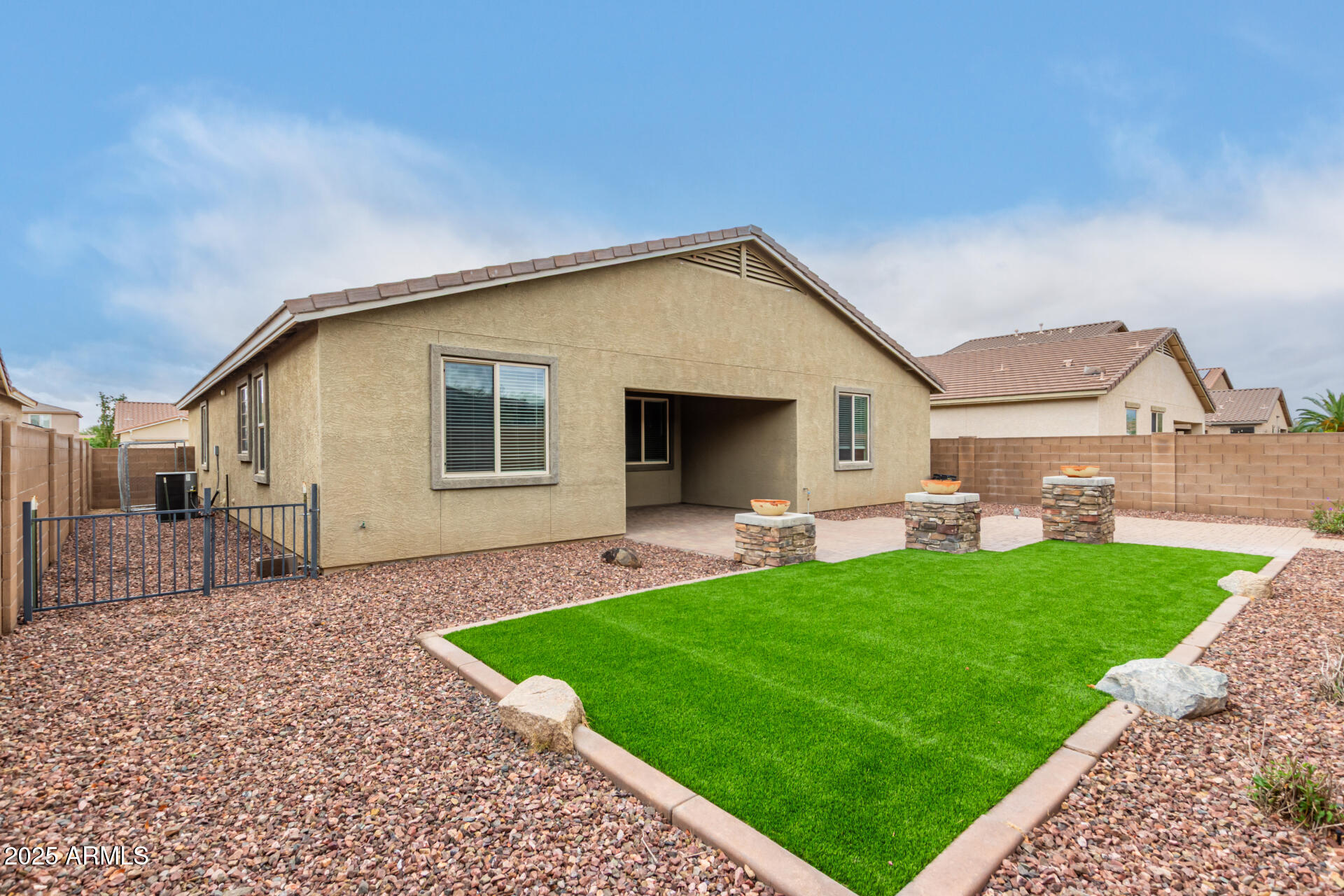 9228 West Black Hill Road Peoria, AZ 85383 - Photo 42 of 44 a view of a house with a backyard