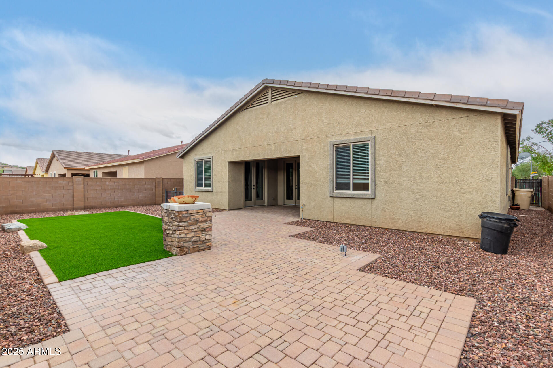 9228 West Black Hill Road Peoria, AZ 85383 - Photo 43 of 44 a front view of a house with a yard and garage