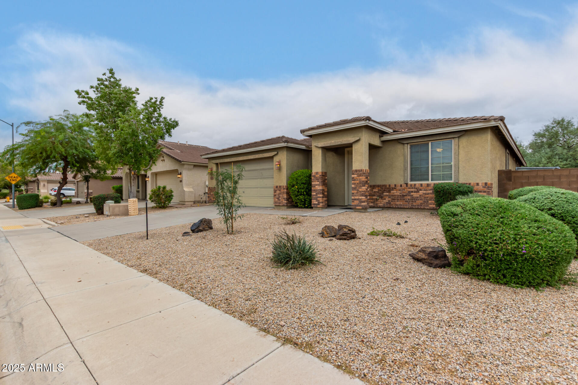 9228 West Black Hill Road Peoria, AZ 85383 - Photo 4 of 44 a front view of a house with garage