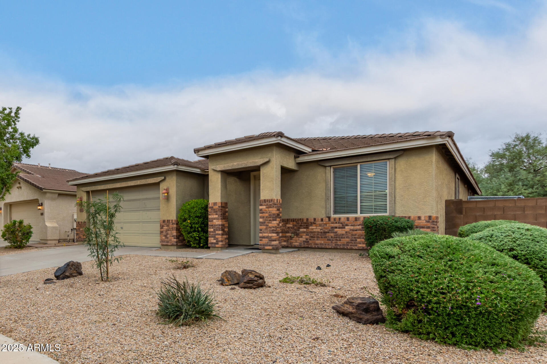 9228 West Black Hill Road Peoria, AZ 85383 - Photo 5 of 44 a front view of a house with a yard
