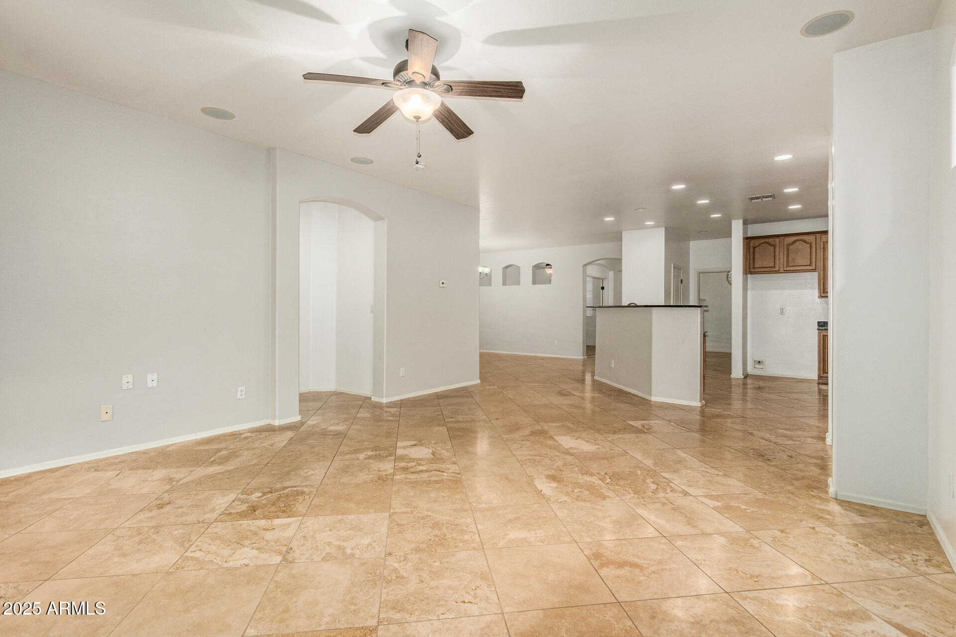9228 West Black Hill Road Peoria, AZ 85383 - Photo 9 of 44 a view of empty room with a kitchen