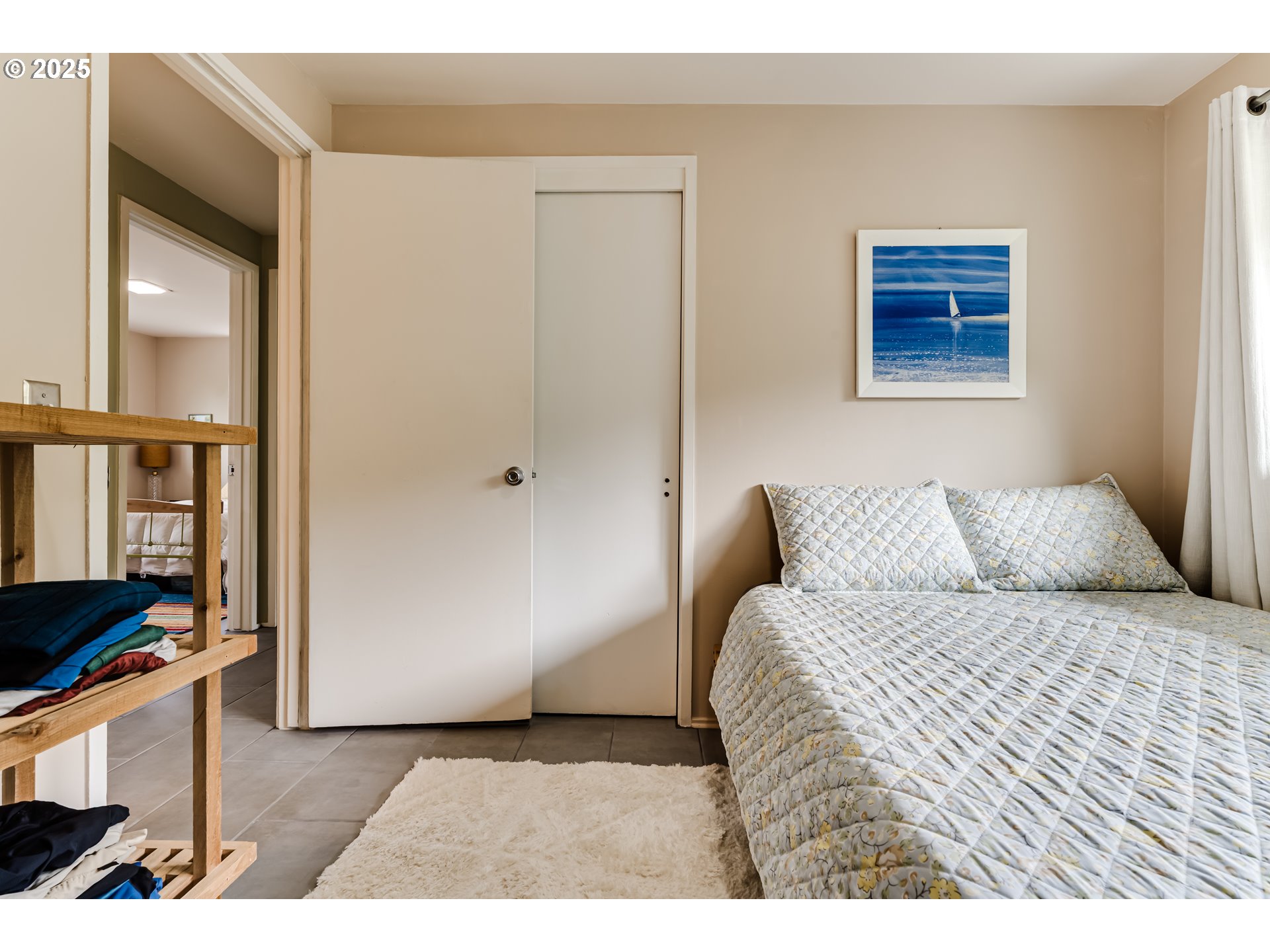 3140 Onyx Street Eugene, OR 97405 - Photo 16 of 32 a bedroom with a bed and a cabinets