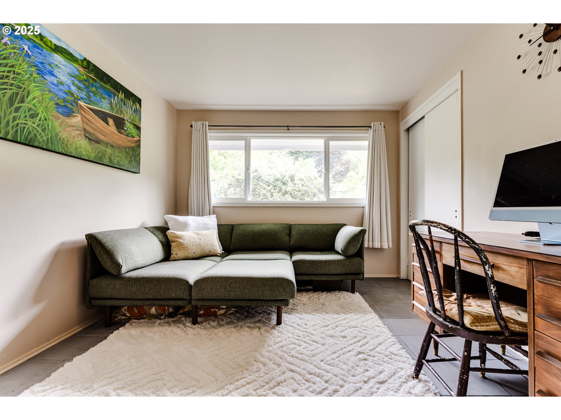 3140 Onyx Street Eugene, OR 97405 - Photo 17 of 32 a living room with furniture and a flat screen tv