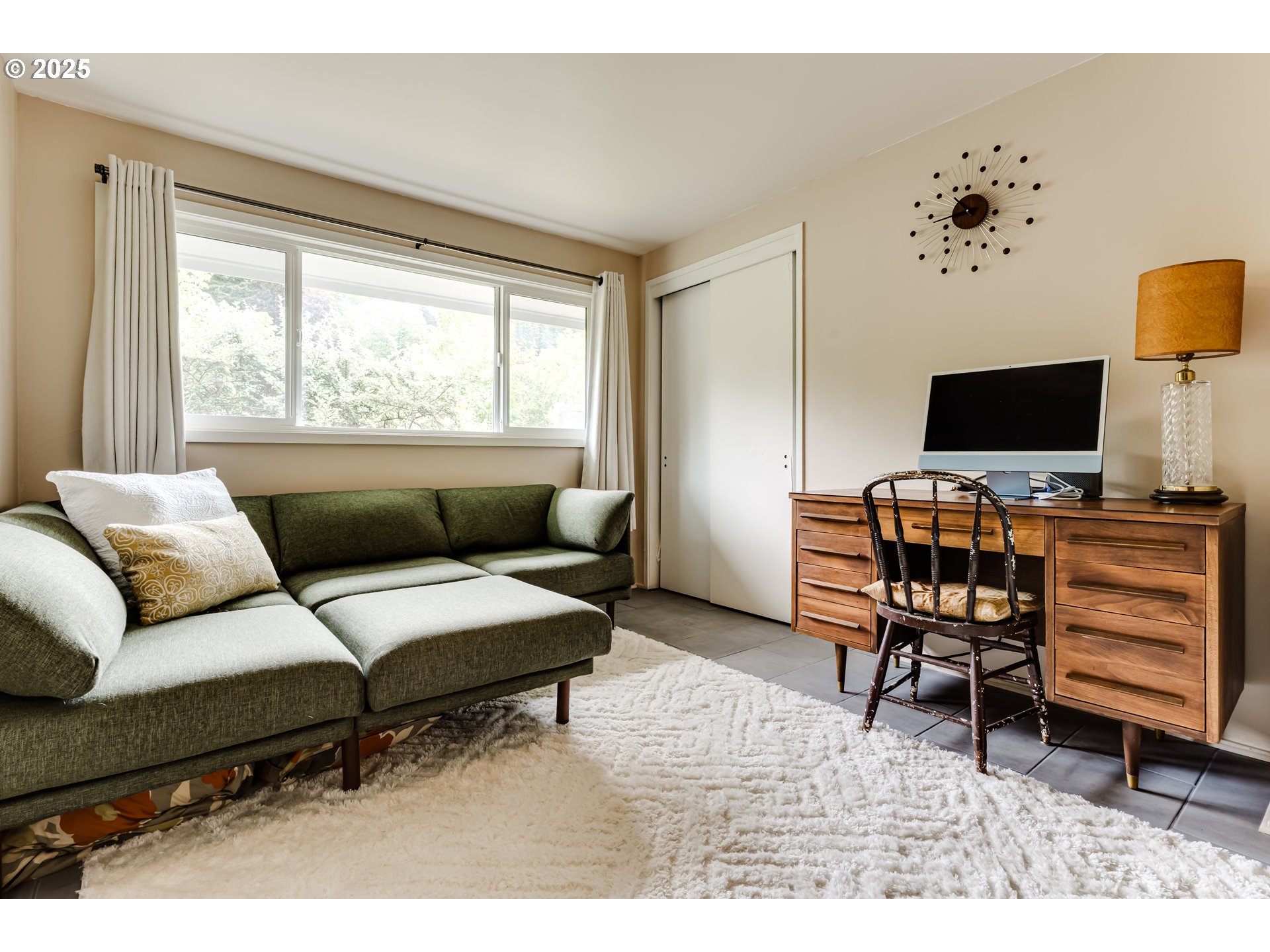 3140 Onyx Street Eugene, OR 97405 - Photo 18 of 32 a living room with furniture and a flat screen tv
