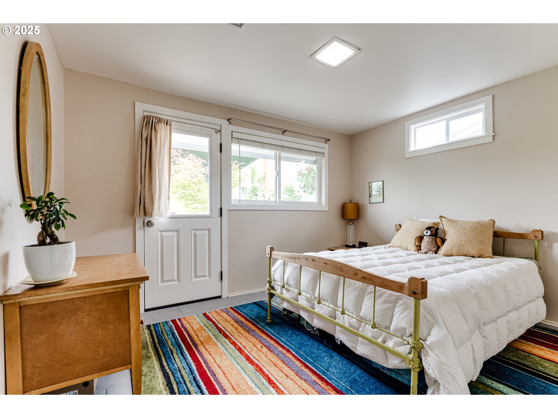 3140 Onyx Street Eugene, OR 97405 - Photo 19 of 32 a bedroom with a bed and wooden floor