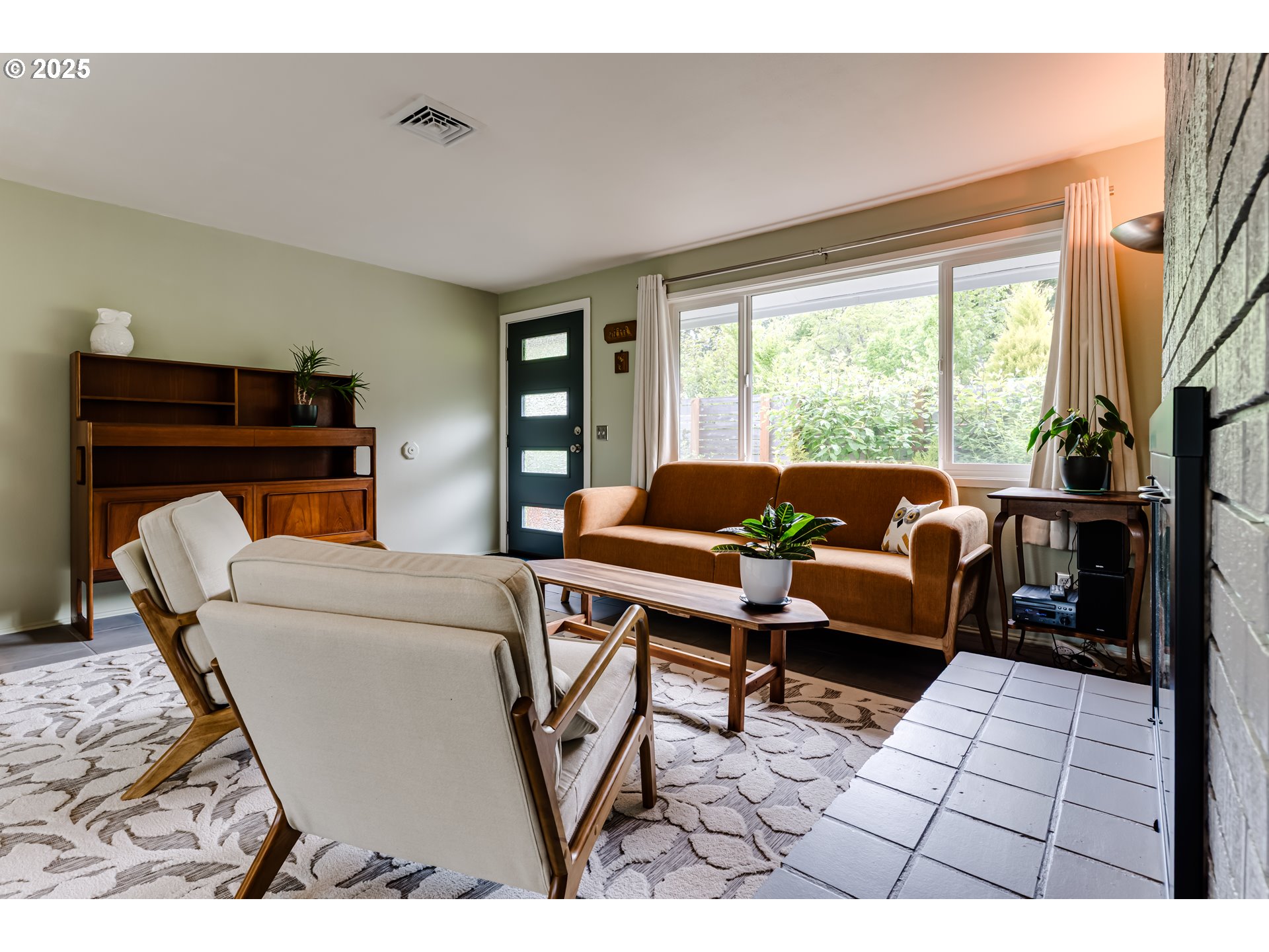 3140 Onyx Street Eugene, OR 97405 - Photo 8 of 32 a living room with furniture and a floor to ceiling window