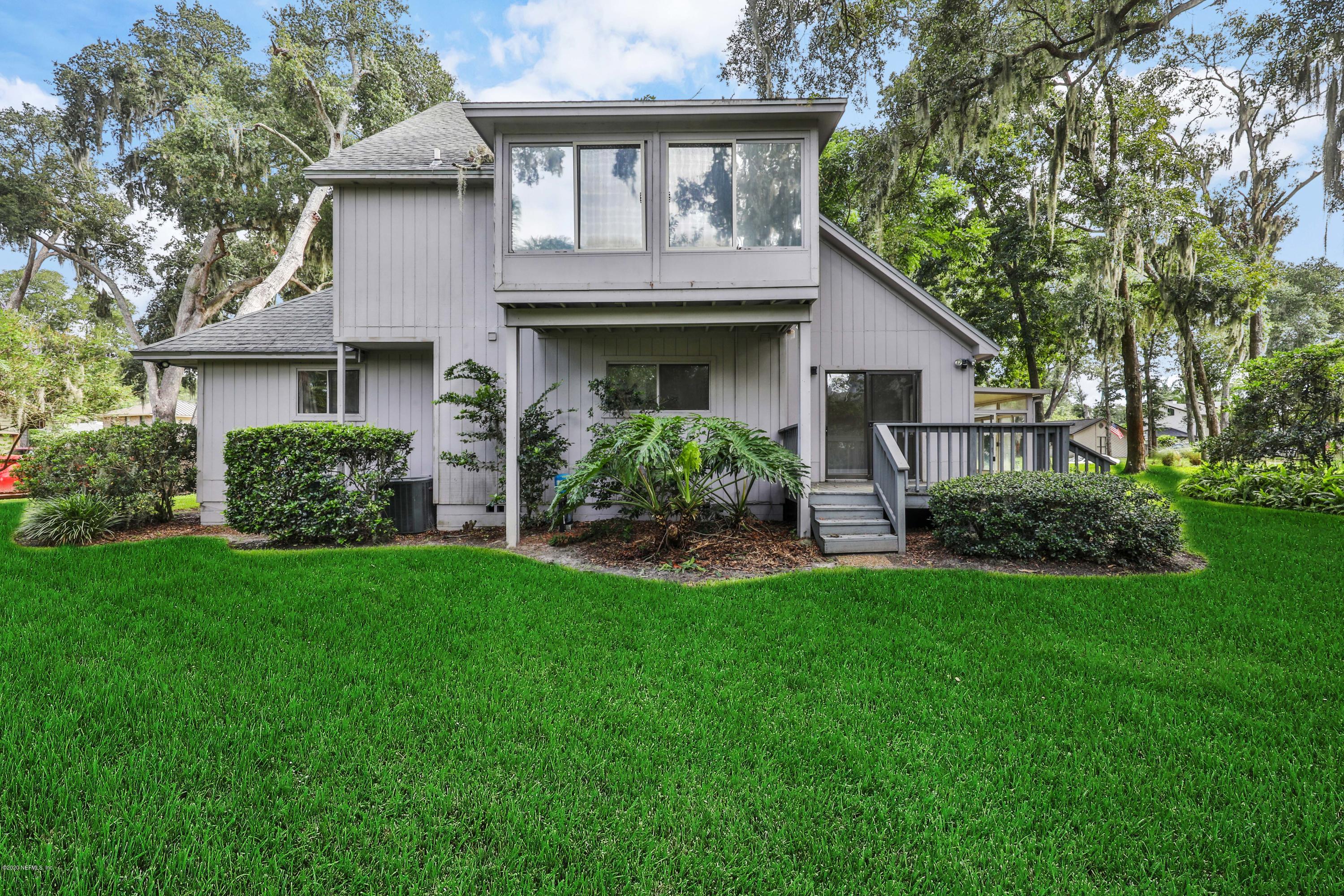 1350 Pinewood Road Jacksonville Beach, FL 32250 - Photo 13 of 45 a front view of a house with garden
