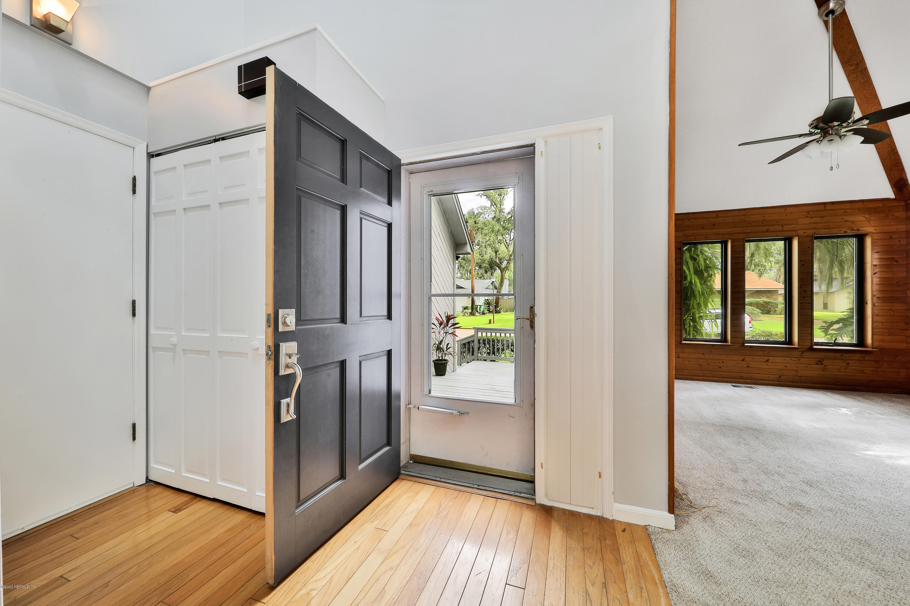 1350 Pinewood Road Jacksonville Beach, FL 32250 - Photo 15 of 45 a view of an entryway with wooden floor and door