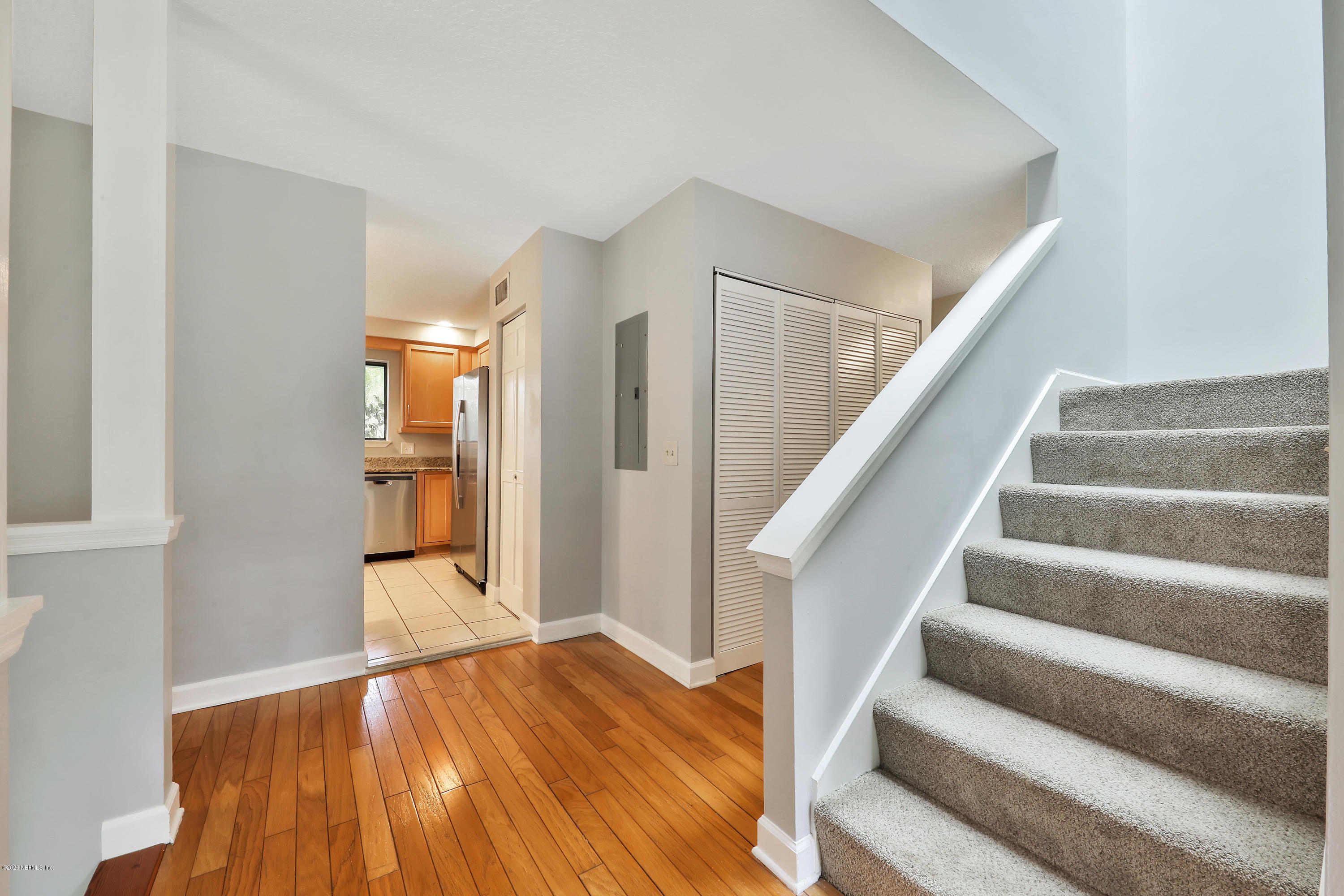 1350 Pinewood Road Jacksonville Beach, FL 32250 - Photo 16 of 45 a view of an entryway with wooden floor and stairs