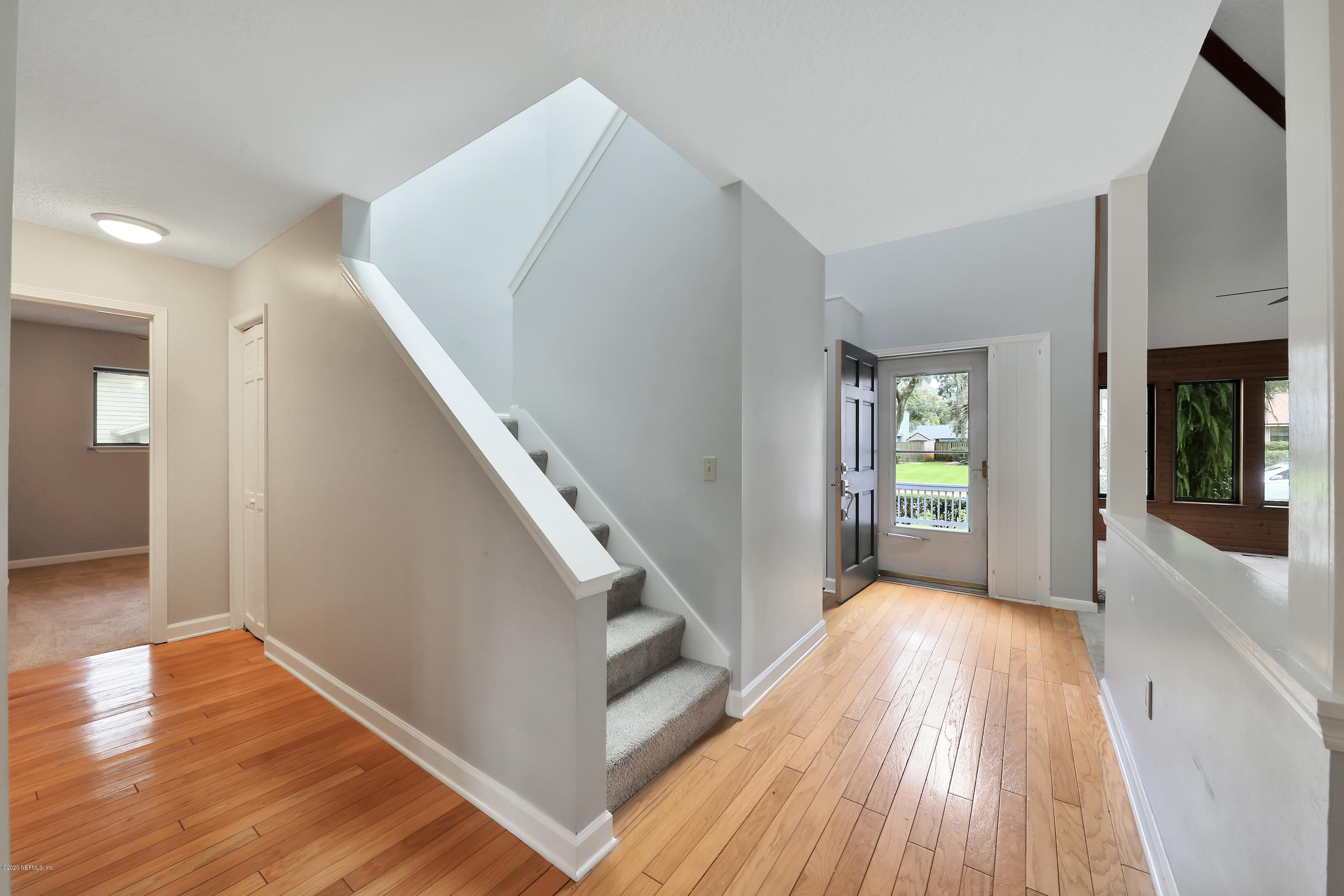 1350 Pinewood Road Jacksonville Beach, FL 32250 - Photo 19 of 45 a view of a hallway view with wooden floor and staircase