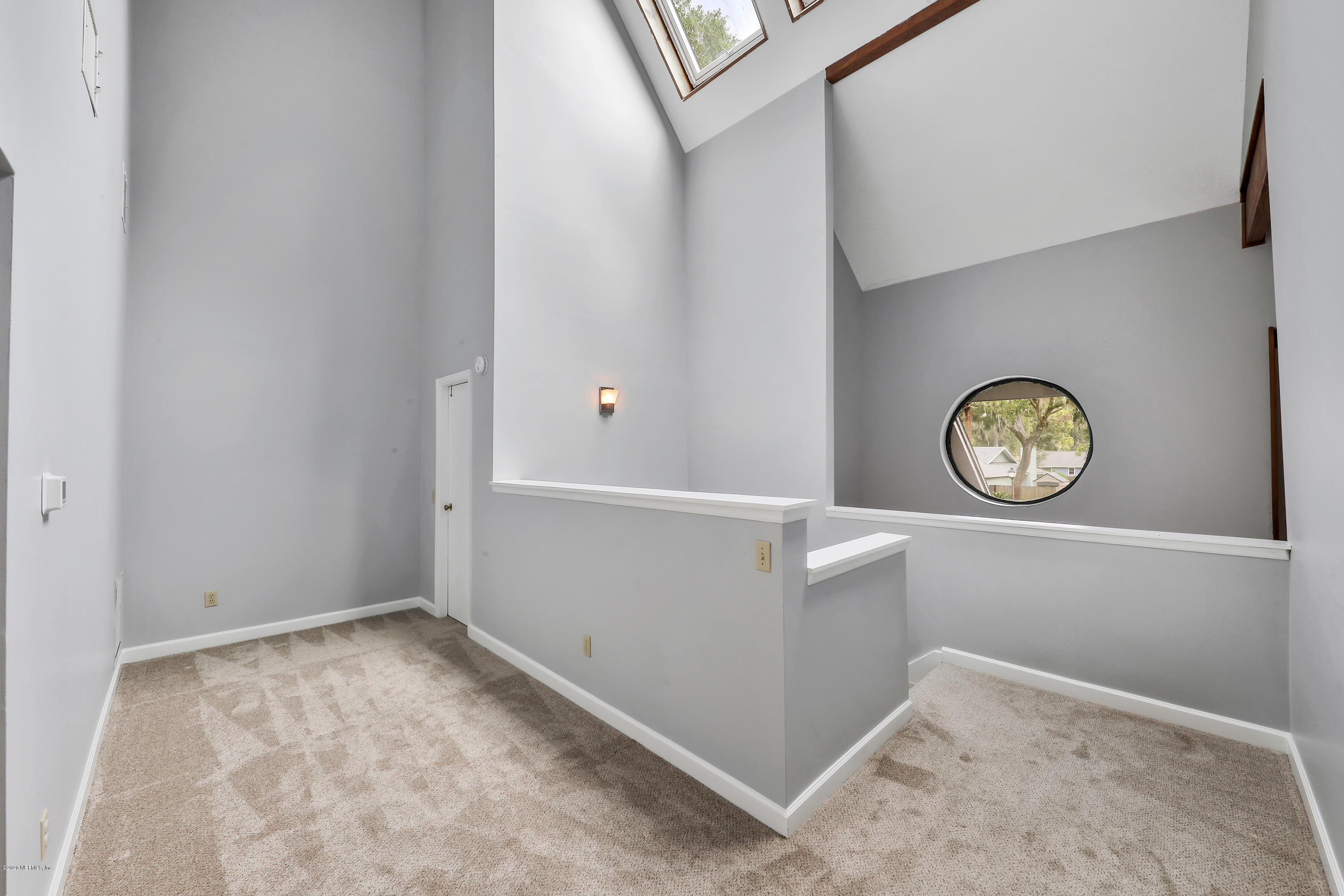 1350 Pinewood Road Jacksonville Beach, FL 32250 - Photo 23 of 45 a view of a storage and utility room with a window