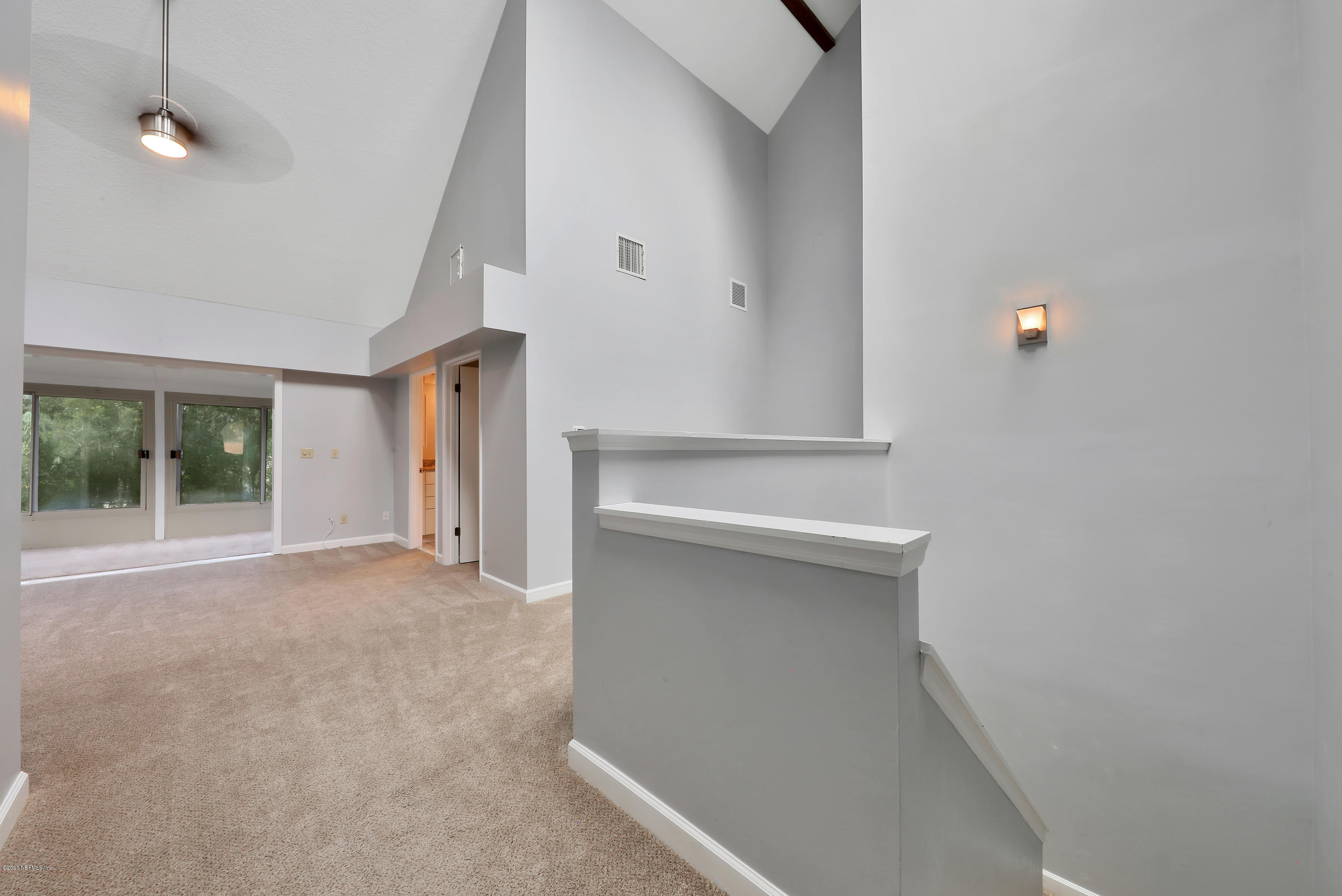 1350 Pinewood Road Jacksonville Beach, FL 32250 - Photo 25 of 45 a view of empty room with wooden floor and fan