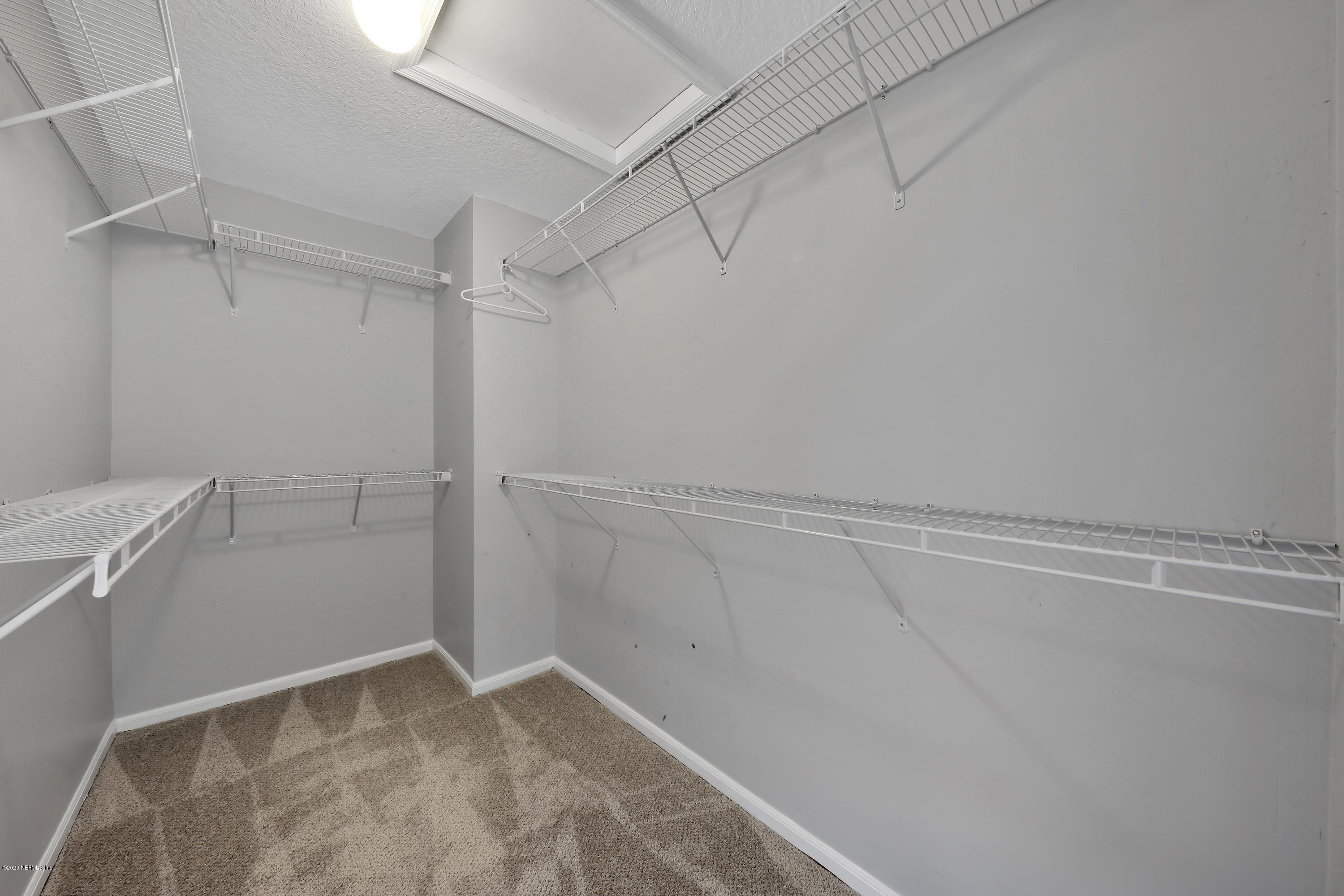 1350 Pinewood Road Jacksonville Beach, FL 32250 - Photo 26 of 45 a view of a room with racks on the wall