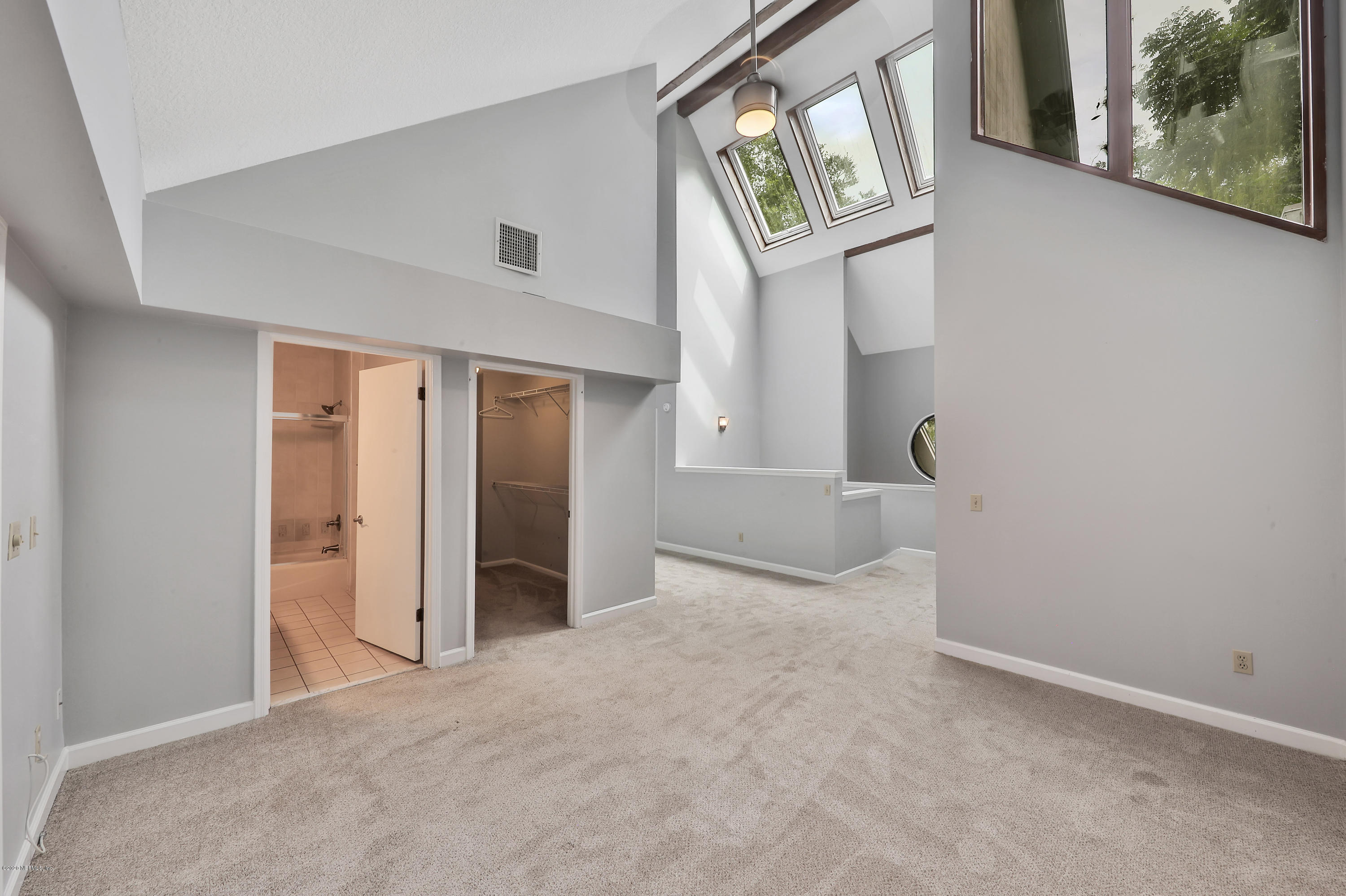 1350 Pinewood Road Jacksonville Beach, FL 32250 - Photo 27 of 45 an empty room with windows and entrance