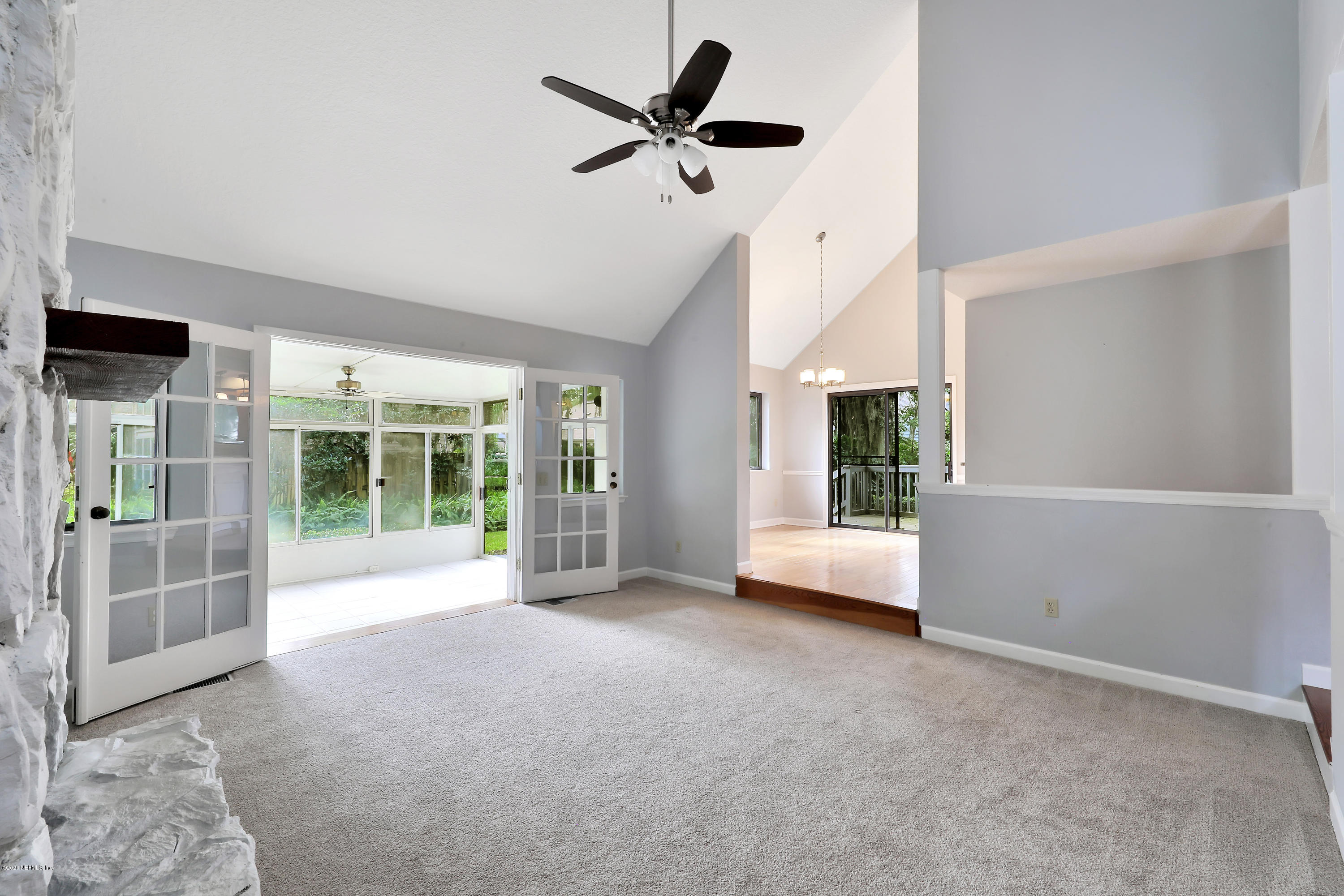 1350 Pinewood Road Jacksonville Beach, FL 32250 - Photo 3 of 45 a view of livingroom with furniture wooden floor and a ceiling fan