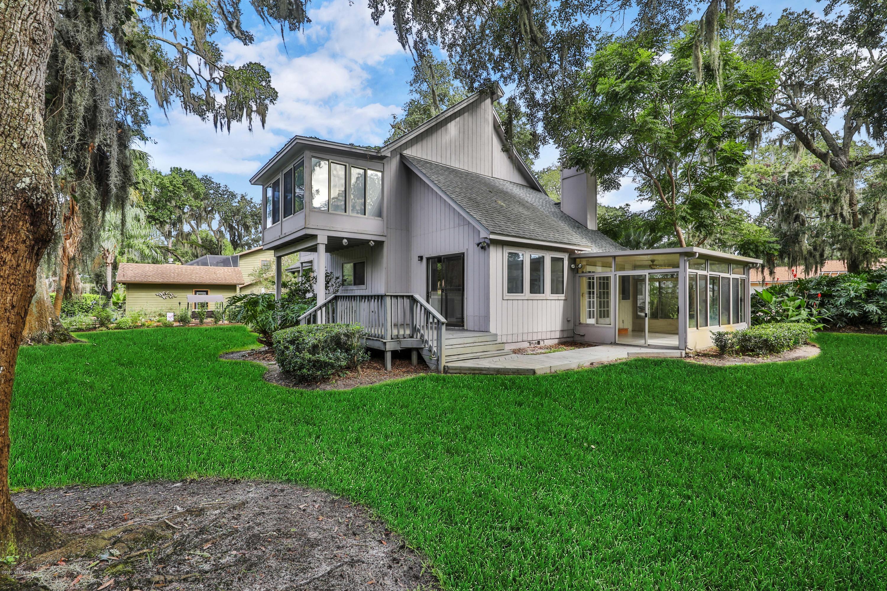 1350 Pinewood Road Jacksonville Beach, FL 32250 - Photo 33 of 45 a front view of house with yard and green space