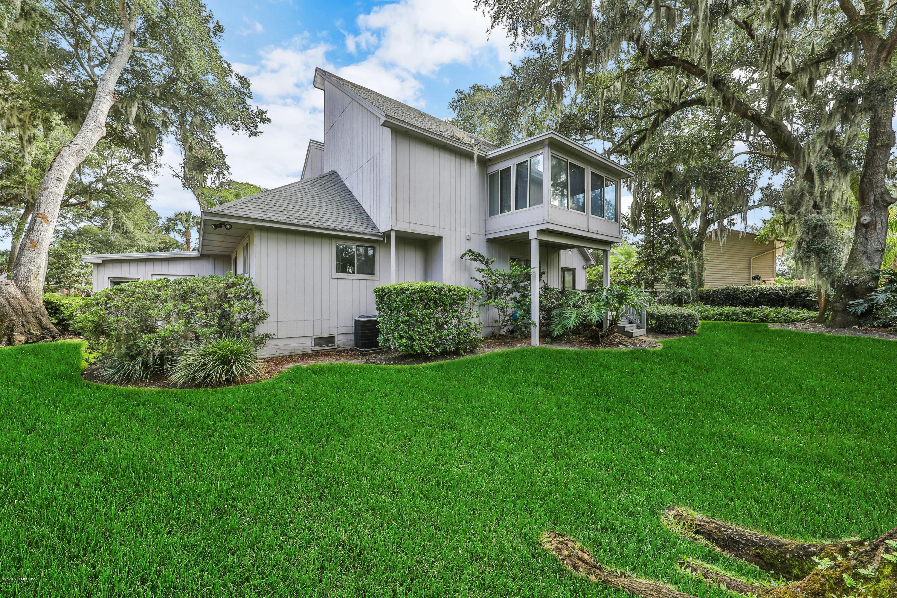 1350 Pinewood Road Jacksonville Beach, FL 32250 - Photo 35 of 45 a front view of a house with a garden