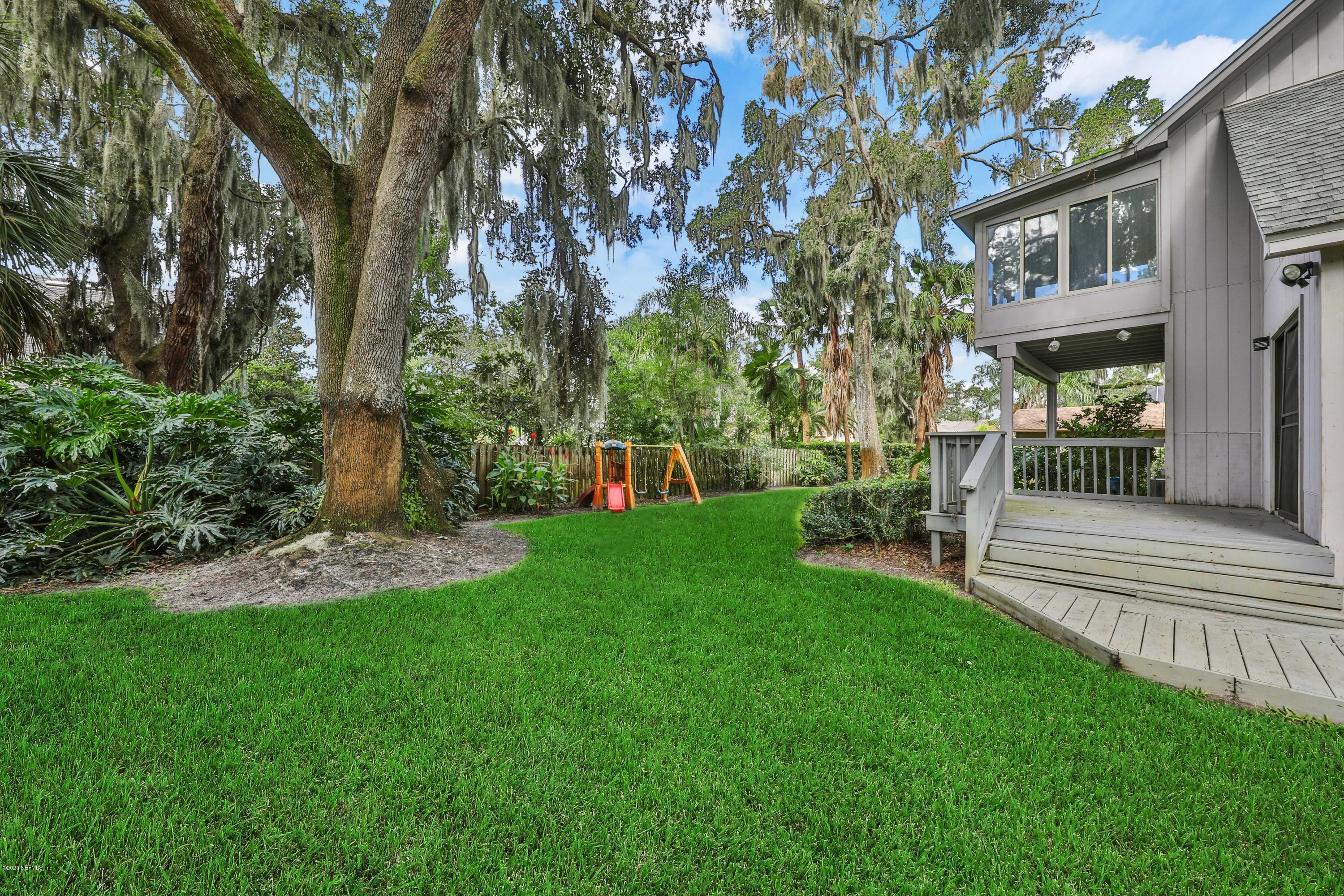 1350 Pinewood Road Jacksonville Beach, FL 32250 - Photo 37 of 45 a view of a chair and table on the garden