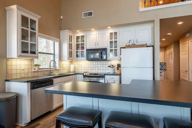 a kitchen with a stove and a sink
