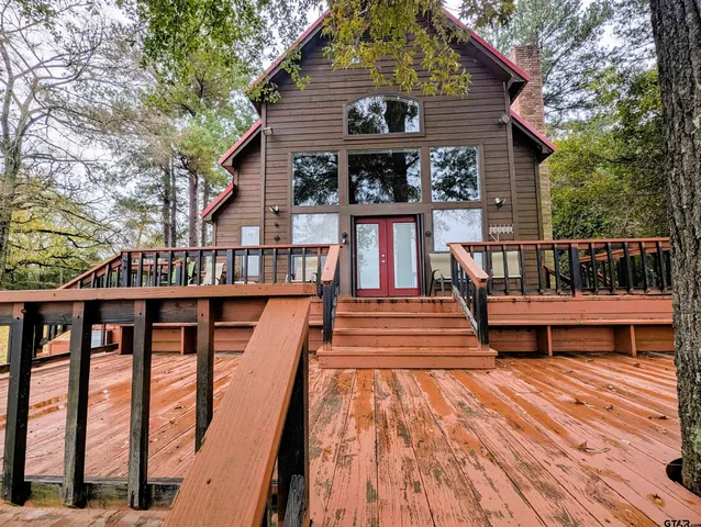 a small pool with lawn chairs