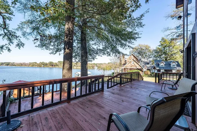 a view of a chairs and tables in the back yard of the house
