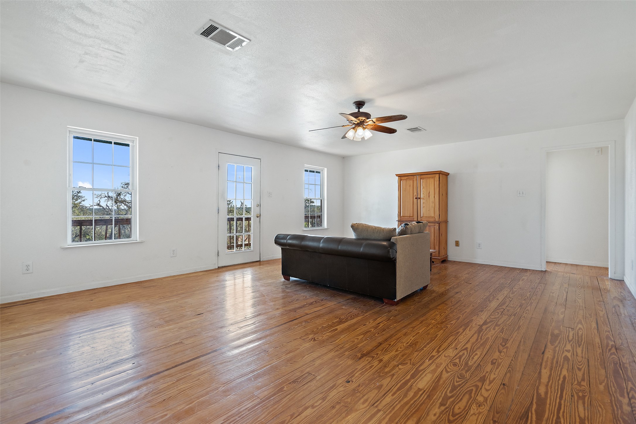 1401 Pursley Road Dripping Springs, TX 78620 - Photo 6 of 35 Living area featuring hardwood / wood-style flooring and ceiling fan