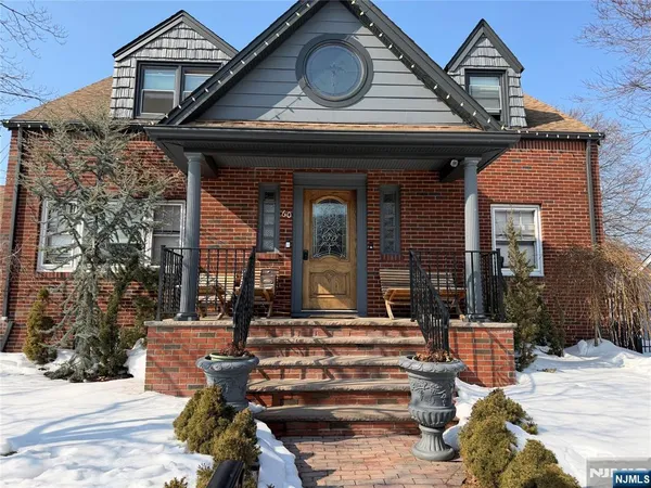 a front view of a house with a porch