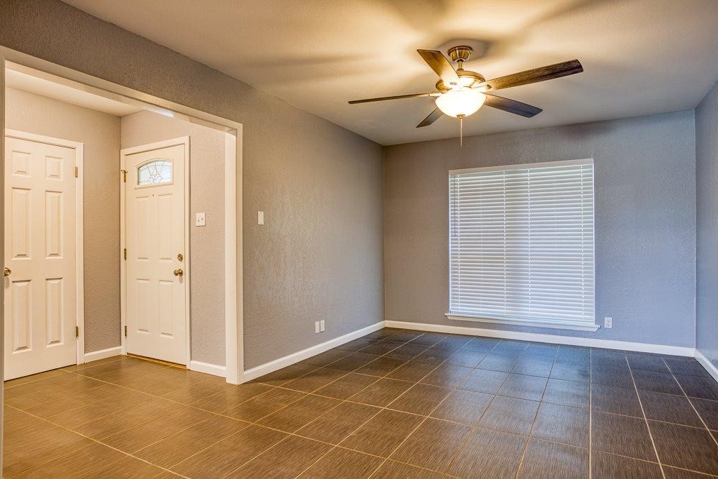 10733 Timbergrove Lane Corpus Christi, TX 78410 - Photo 13 of 40 a view of an empty room with a ceiling fan and window