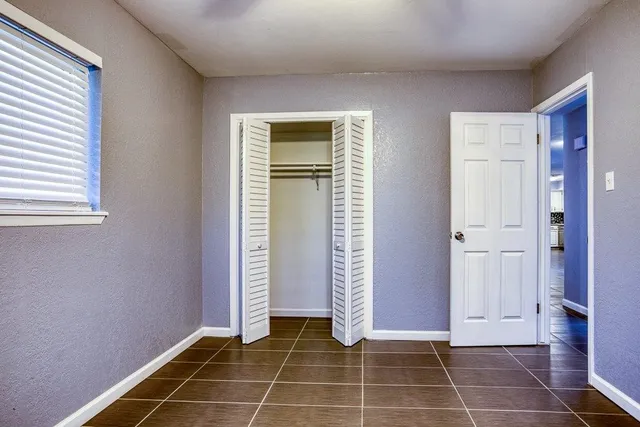 an empty room with windows