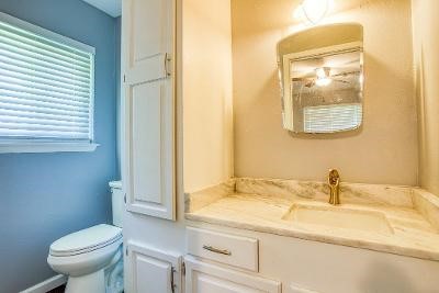 10733 Timbergrove Lane Corpus Christi, TX 78410 - Photo 23 of 40 a bathroom with a sink and a toilet