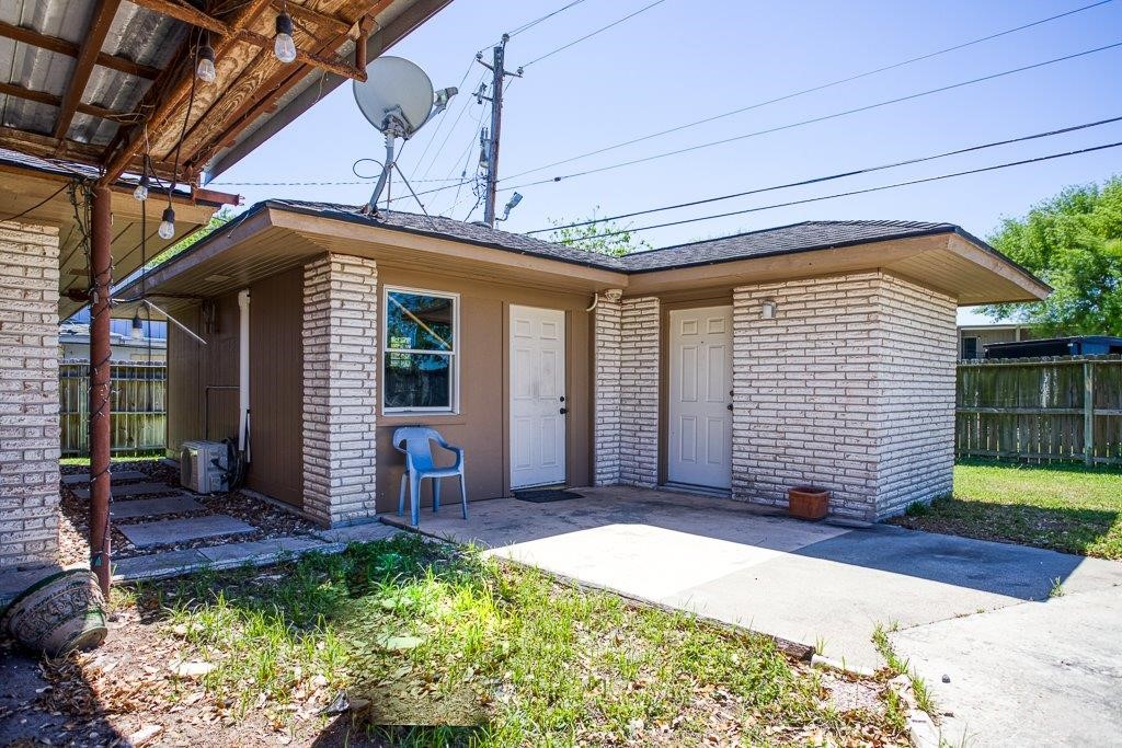 10733 Timbergrove Lane Corpus Christi, TX 78410 - Photo 27 of 40 a front view of a house with garden